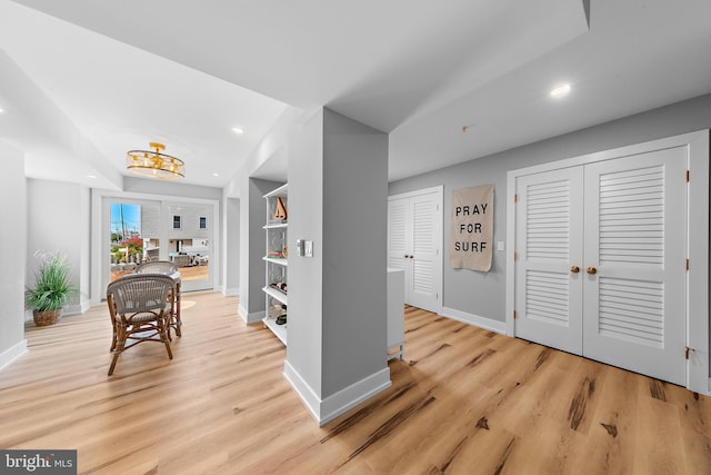 dining room featuring light wood finished floors, recessed lighting, and baseboards