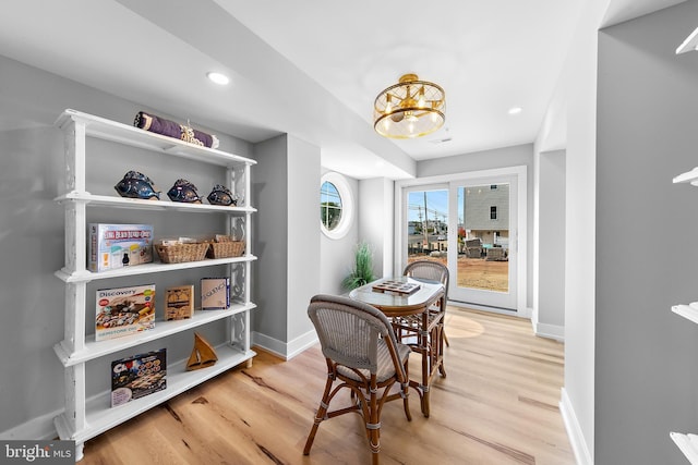 dining room featuring recessed lighting, light wood-style flooring, and baseboards