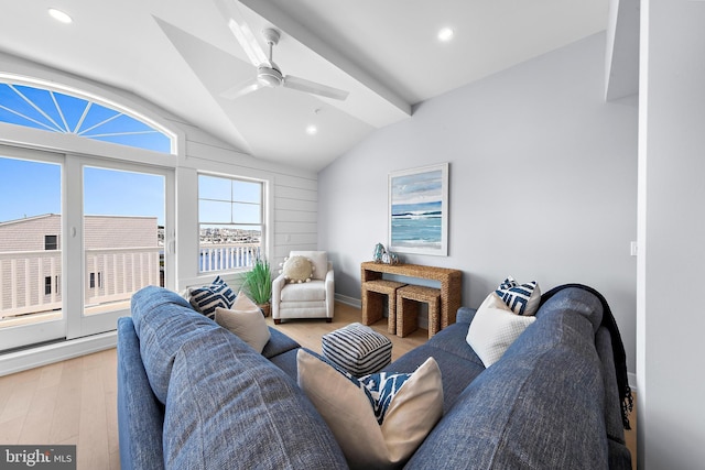 living room with lofted ceiling, light wood finished floors, ceiling fan, and recessed lighting