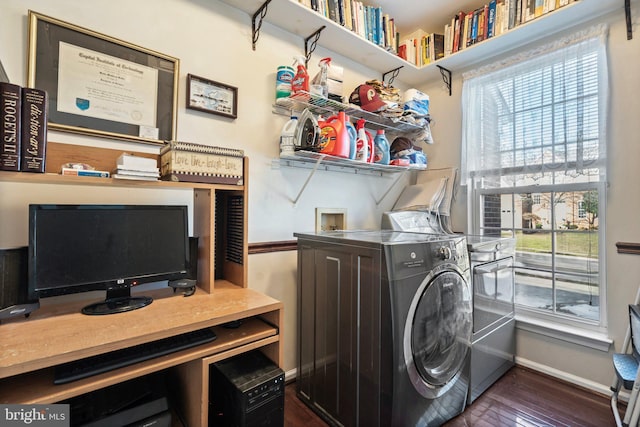 washroom with dark hardwood / wood-style flooring and separate washer and dryer