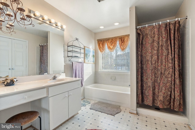 bathroom with vanity and a bathing tub