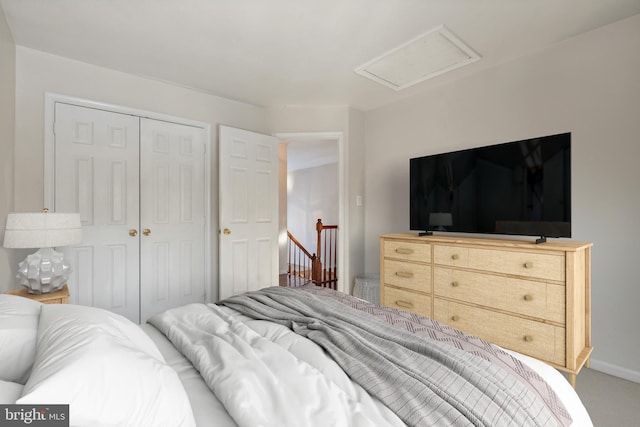 carpeted bedroom featuring a closet