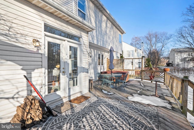 wooden deck featuring french doors