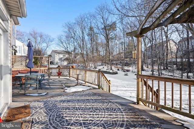 view of snow covered deck