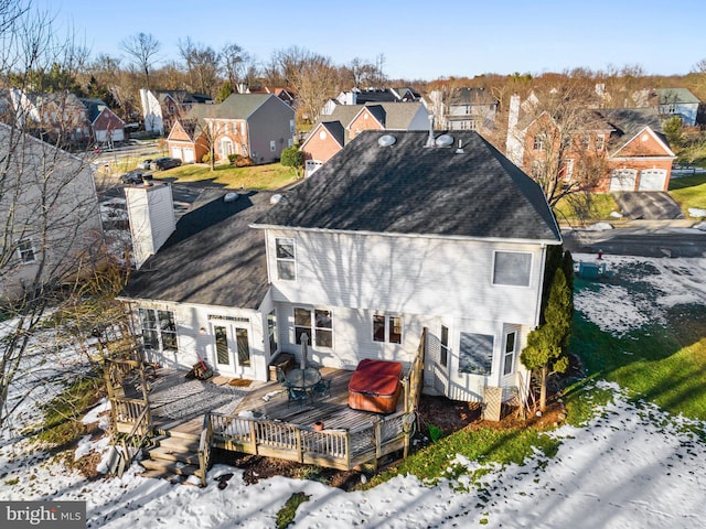 rear view of property with french doors and a deck