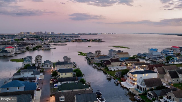 aerial view at dusk with a water view