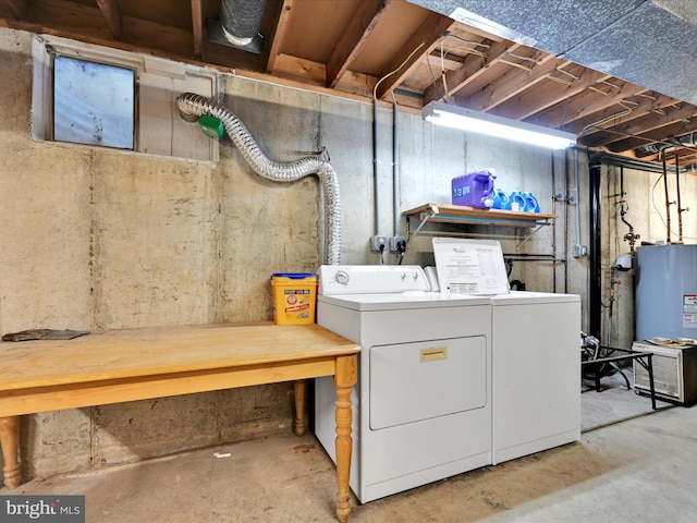 laundry area with washer and clothes dryer and water heater