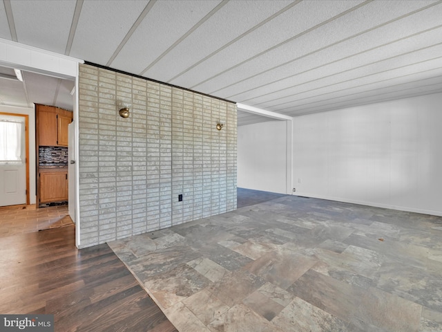 spare room with dark wood-type flooring