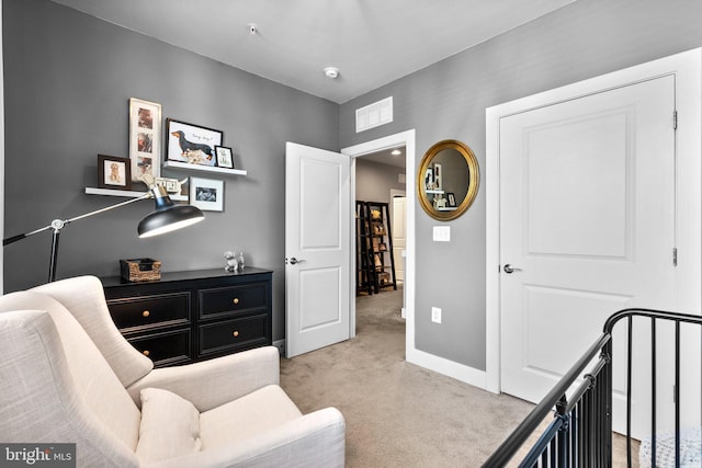 bedroom with visible vents, light colored carpet, and baseboards