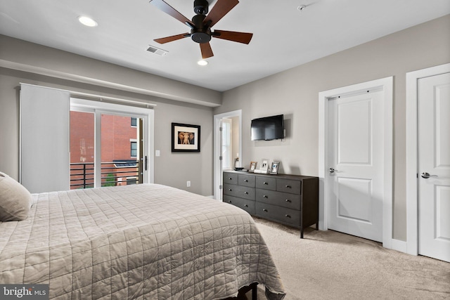 bedroom featuring recessed lighting, visible vents, light colored carpet, and access to exterior