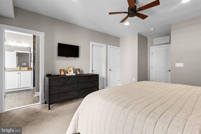 bedroom with visible vents, recessed lighting, ceiling fan, light carpet, and connected bathroom