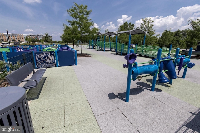 view of community with playground community and fence