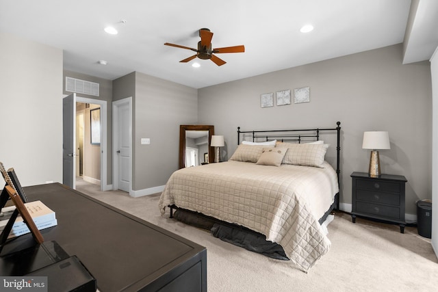 bedroom with recessed lighting, visible vents, light colored carpet, and baseboards