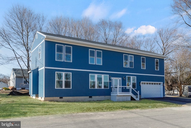 view of front of property with a garage, crawl space, driveway, and a front lawn