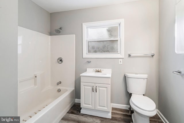 full bathroom with vanity, toilet, tub / shower combination, and hardwood / wood-style floors