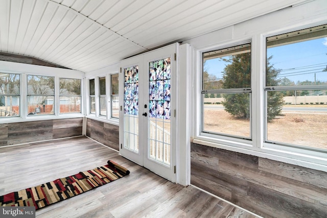 unfurnished sunroom featuring wood ceiling and lofted ceiling