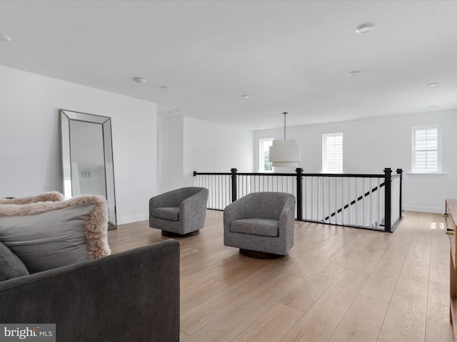 living area with light hardwood / wood-style floors