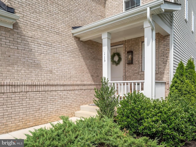 doorway to property featuring a porch