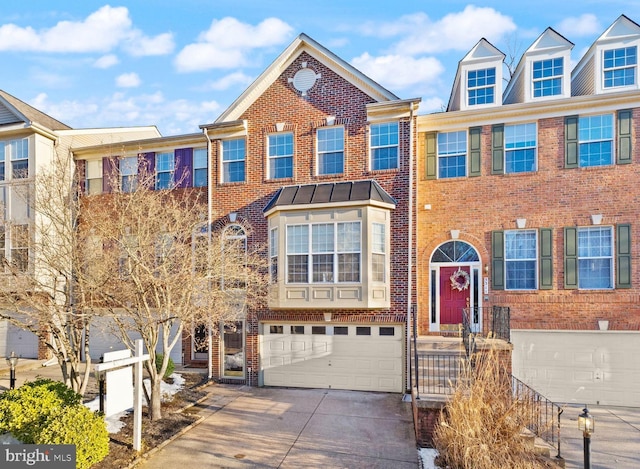 townhome / multi-family property featuring a garage