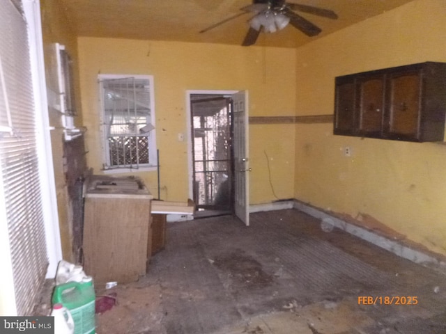 interior space featuring ceiling fan