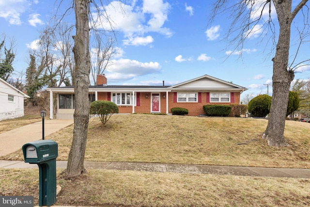 single story home with a carport, driveway, a chimney, and a front lawn