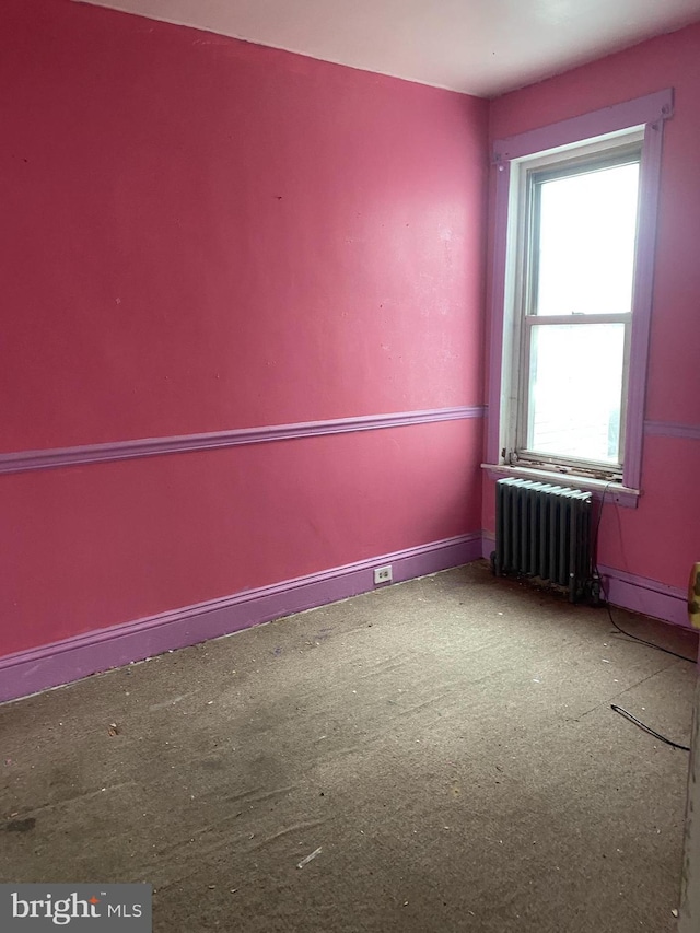 empty room featuring radiator