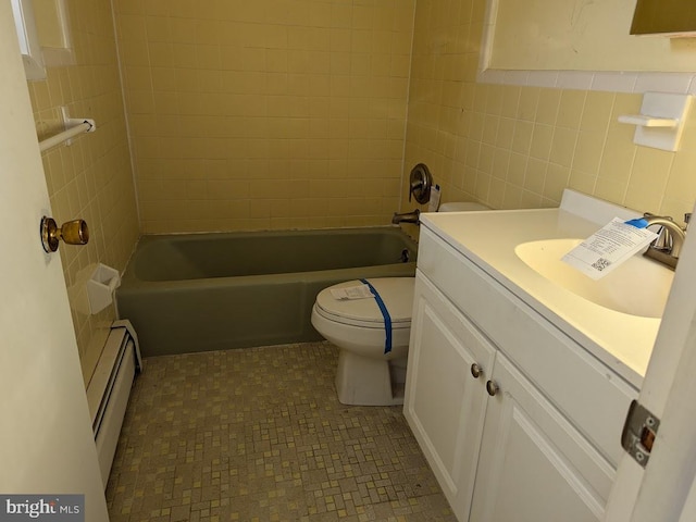 full bathroom featuring tiled shower / bath, a baseboard radiator, tile walls, vanity, and toilet