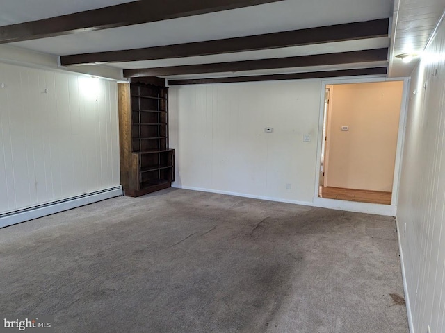 garage with a baseboard radiator and wood walls