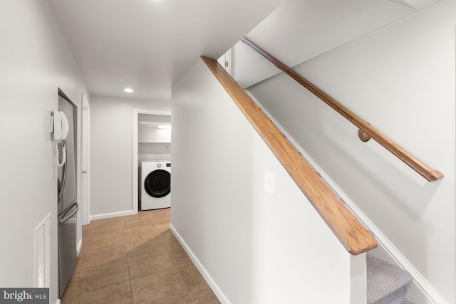 hallway with tile patterned floors, recessed lighting, baseboards, washer / dryer, and stairs