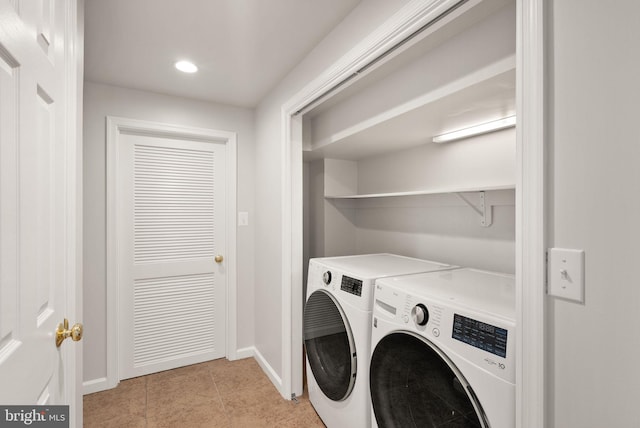 laundry area with baseboards, washer and clothes dryer, light tile patterned floors, laundry area, and recessed lighting