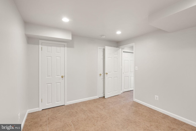 finished below grade area featuring recessed lighting and baseboards