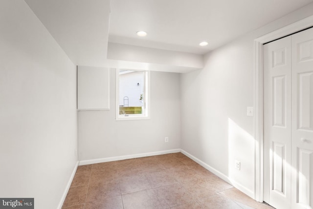 interior space featuring recessed lighting and baseboards