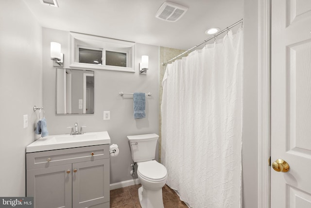 full bath with vanity, baseboards, visible vents, tile patterned floors, and toilet