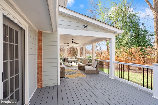 wooden terrace featuring ceiling fan