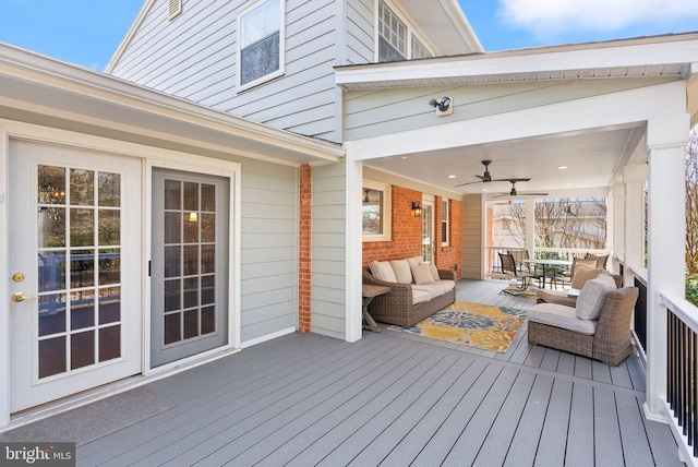 wooden deck featuring a ceiling fan and an outdoor hangout area