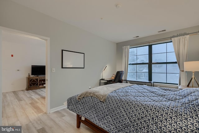 bedroom featuring light wood-type flooring