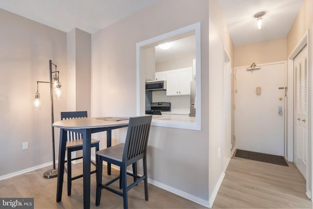 dining room featuring light hardwood / wood-style flooring