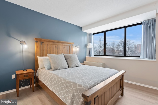 bedroom featuring light wood-type flooring