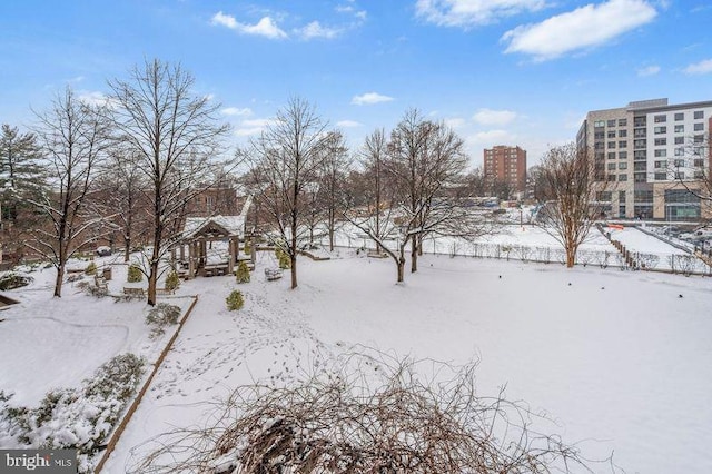 yard covered in snow featuring a gazebo