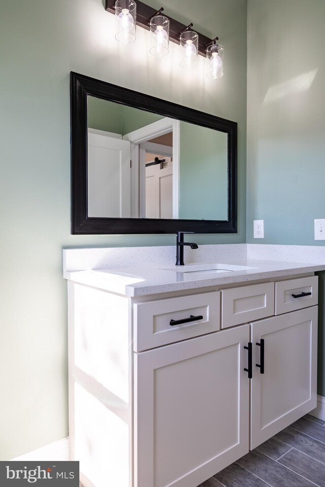 bathroom featuring wood tiled floor and vanity