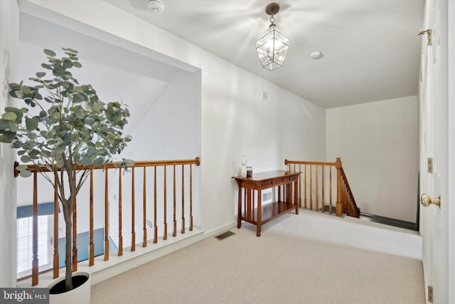 interior space with carpet and a chandelier