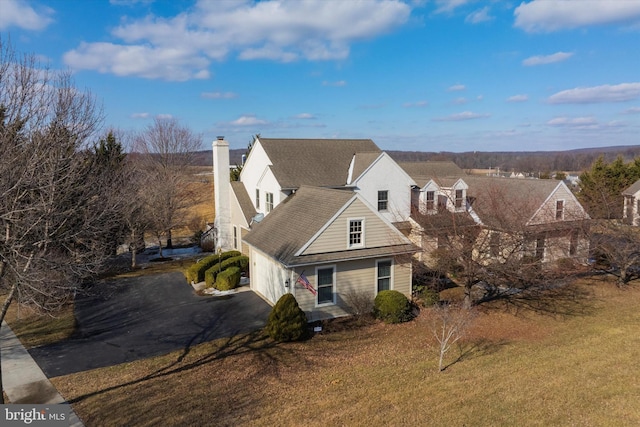 view of front of property with a garage and a front yard