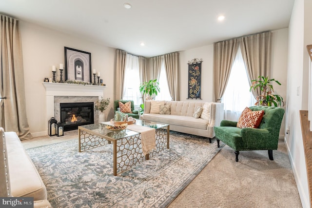 carpeted living room featuring a fireplace