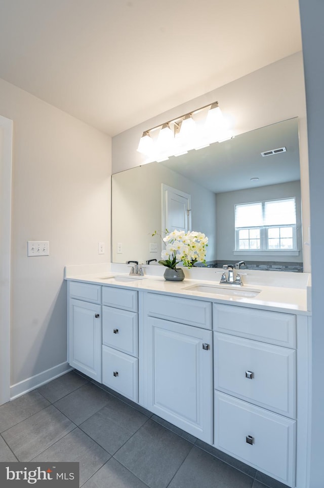 bathroom with tile patterned flooring and vanity