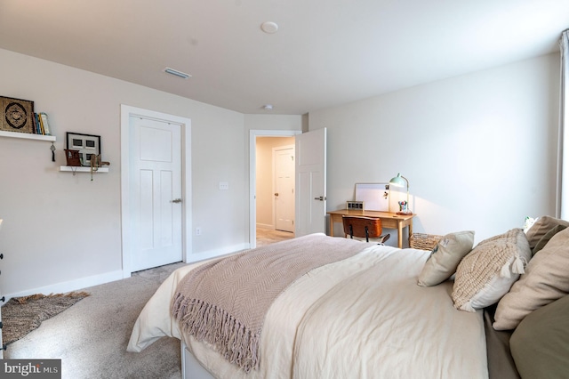 bedroom with light colored carpet