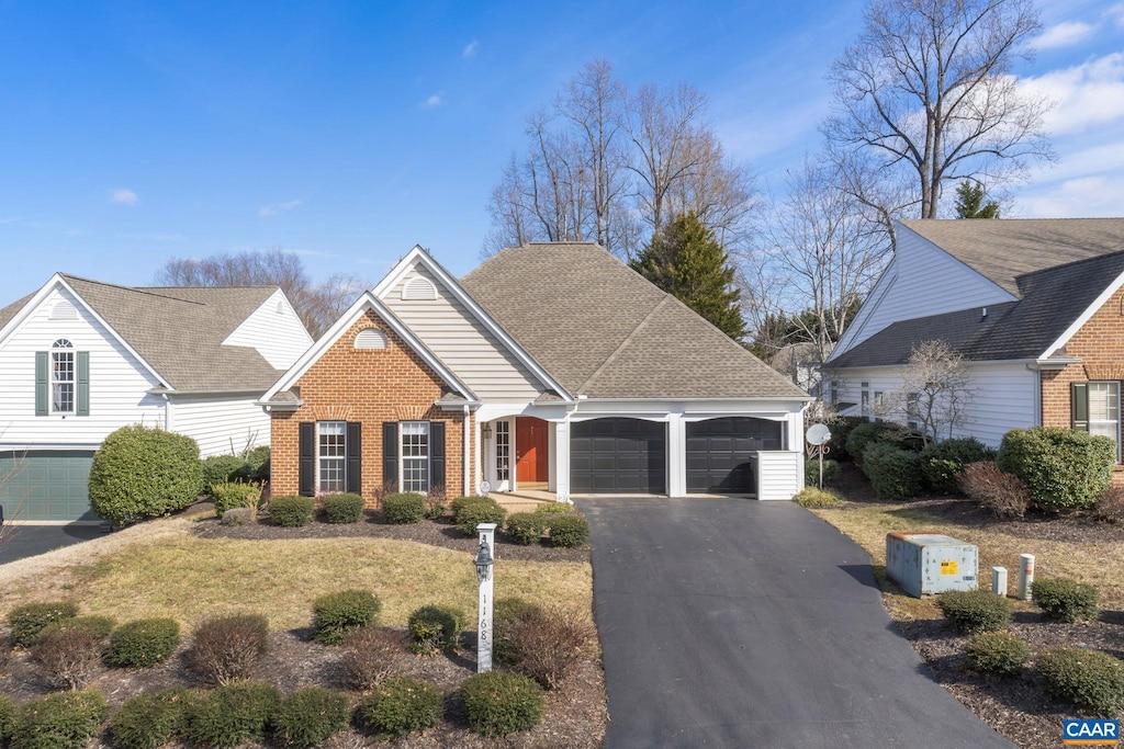 view of front of home featuring a garage and a front yard