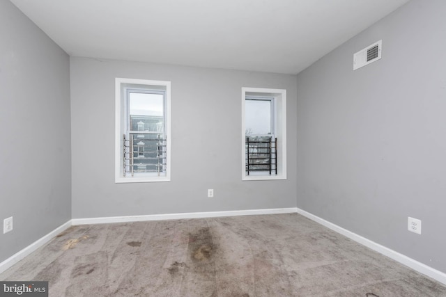 empty room with light colored carpet