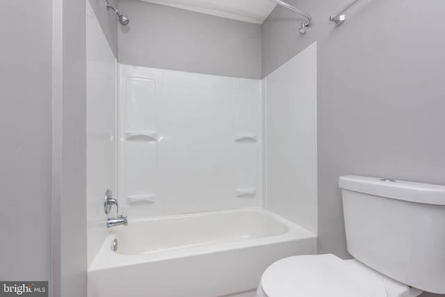 bathroom featuring toilet and washtub / shower combination