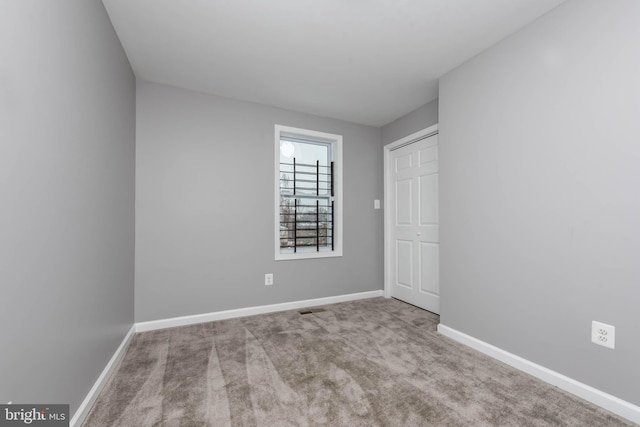 view of carpeted spare room