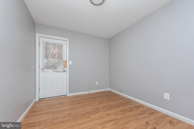 spare room featuring light hardwood / wood-style flooring